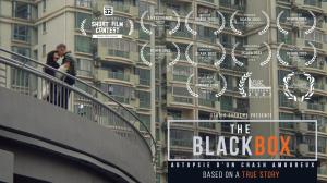 Under the vibrant city lights of Shanghai, a moment frozen in time. On an overhead bridge, the lead characters of 'The Black Box' share a passionate kiss, their love story unfolding against the backdrop of a world in the grip of a pandemic. This poignant