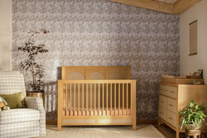 The all-new Eloise 4-in-1 Convertible Crib and matching 7-Drawer Dresser in warm honey (Namesake)